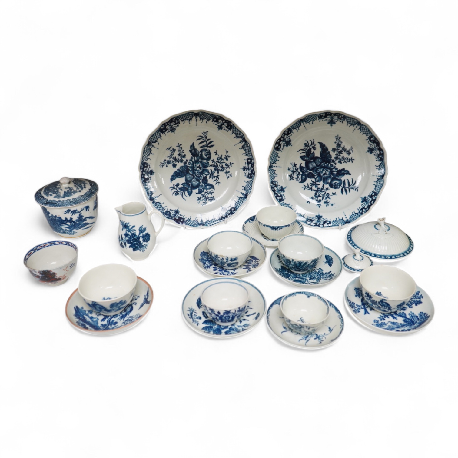 A collection of late 18th century Worcester, Caughley and Liverpool blue and white tea wares to include tea bowls and saucers, jug, suger basin and cover and two dishes etc, largest 23cm in diameter